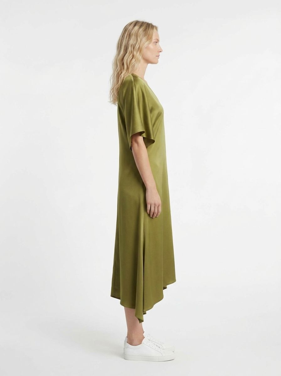 AI-generated model wearing an olive asymmetric dress, side view