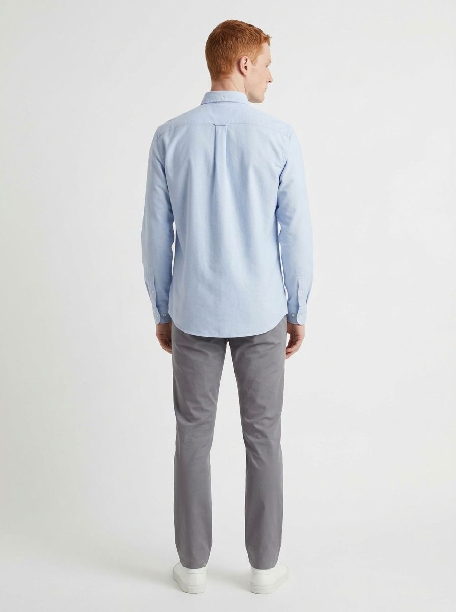 AI-generated model wearing a light blue shirt, back view